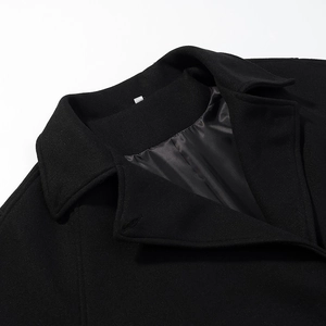Women's black loose wool-blend overcoat featuring elegant double-breasted lapel collars