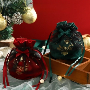 Velvet Christmas drawstring gift bags in red and green with stars and festive bells
