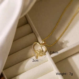 Detailed view of 18K gold plated snowflake heart necklace in a luxury velvet gift box