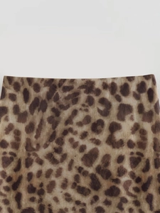 Detail shot of breathable leopard print mesh fabric with translucent texture