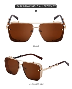 Detail view of square frame sunglasses with dark brown lenses and gold engraved temples