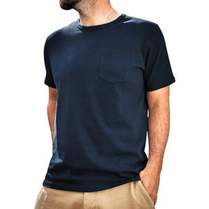 Detailed close-up of navy blue cotton Henley shirt featuring front pocket and button neckline