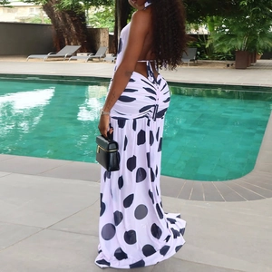 Polka dot backless halter maxi dress with drawstring detail by a poolside