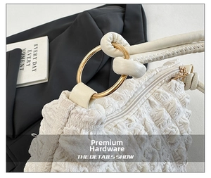 Detailed macro view of white bubble texture fabric with premium gold metal ring hardware