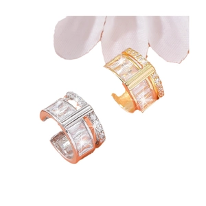 Creative transparent gemstone ear clips in gold and silver finish on flower petals
