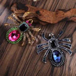 Exquisite rhinestone spider brooches with colorful crystals set on natural driftwood