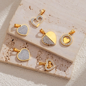 Exquisite 18k gold plated stainless steel heart pendants with zircon inlay on stone surface