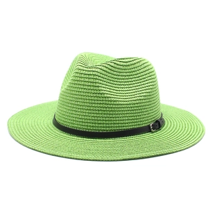 Green foldable straw sun hat with black leather band and buckle in classic fedora style