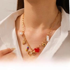 Detailed view of vintage gold-plated necklace with colorful acrylic beads and charms