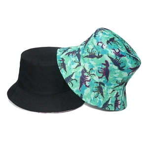 Classic cotton bucket hats in solid black and green dinosaur silhouette pattern print