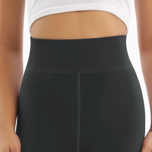 Detailed macro shot of the ribbed high waistband on these warm black winter leggings