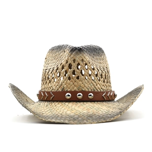 Detail of breathable hollow weave and leather belt with silver studs on cowboy straw hat