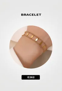 Detail of 18K gold plated double layer chain bracelet with rhombus charms on wrist