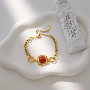 Luxurious stainless steel gold chain bracelet with red agate bead in petal design