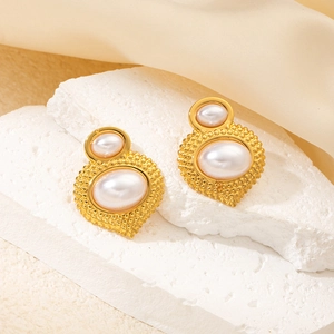 Vintage gold pearl earrings with baroque style on stone base for elegant women