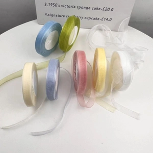 Flat lay of colorful 2cm sheer organza ribbons for floral art and gift wrapping
