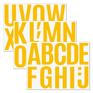 Close-up of three 4-inch bold yellow uppercase letter stickers for wall and car DIY decoration