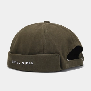 Detail of Chill Vibes white embroidery on olive green cotton twill docker cap