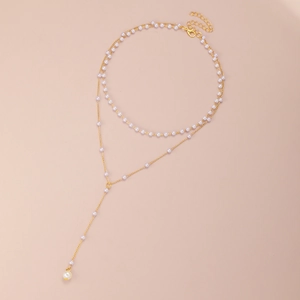 Double-layer gold Y-shaped necklace with delicate pearls and long tassel pendant