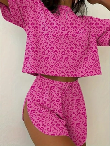 Detailed view of pink leopard print crop top and high slit drawstring shorts set