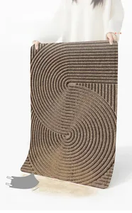 Details einer dunkelbraunen PVC-Eingangsmatte mit Spiralstruktur zur Reinigung