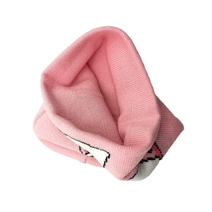 Pink knit kids' unicorn beanie featuring thick jacquard texture and geometric patterns