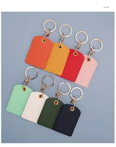 Flat lay of colorful PU leather access card holders with gold keychains in 8 vibrant colors