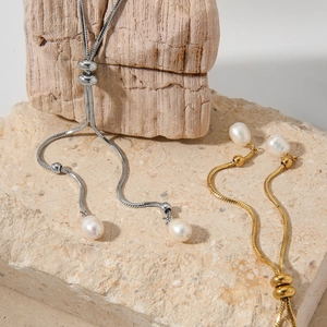 Adjustable Y-shaped necklace with natural pearls on gold and silver snake chains