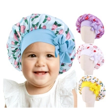Detailed collage of floral baby turbans with bows in blue, purple, white, and yellow colors