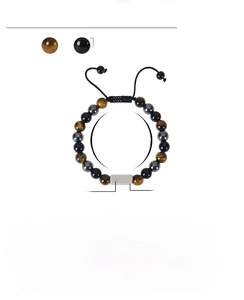 Detailed view of 8mm tiger eye and obsidian beads with adjustable braided cord and steel charm