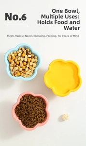Detailed top view of flower-shaped ceramic cat bowls in pink, blue, and yellow colors