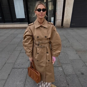 Classic khaki double-breasted trench coat with lantern sleeves and double waist belts