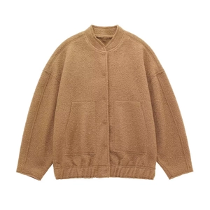 Detail of camel brown fleece bomber jacket featuring a high collar and soft plush texture