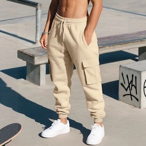 Beige fleece cargo joggers for men featuring drawstring waist and large side utility pockets