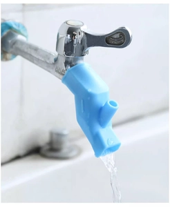 Close-up of blue silicone faucet extender with dual-outlet water flow for children