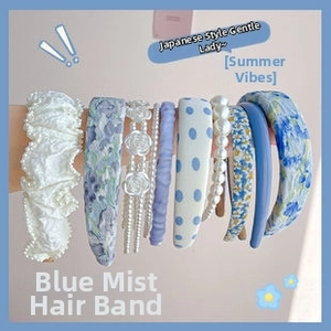 Detailed set of hazy blue headbands featuring pearl accents and floral fabric patterns