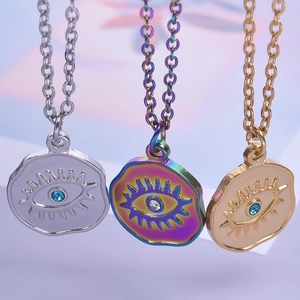Three-piece Evil Eye pendant necklaces in gold, silver, and iridescent 18k plated steel