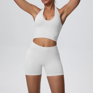 Detail of light grey seamless yoga set showing high waist shorts and halter neck sports bra
