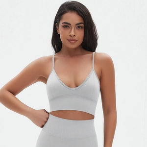 Detail of light blue seamless yoga set with thin straps and high waist compression leggings