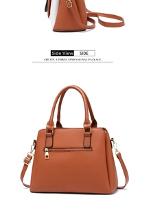 Detail view of contrast leather tote with back zipper pocket and adjustable strap