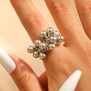 Retro beaded silver alloy ring featuring textured small metallic balls in an open design