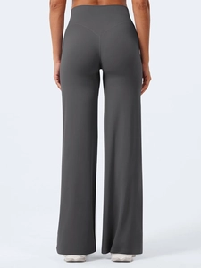 Pantaloni da yoga grigio scuro a vita alta e gamba larga, vista posteriore design minimale