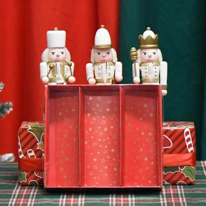 Three 15cm wooden nutcracker soldier figurines set in a festive red Christmas gift box