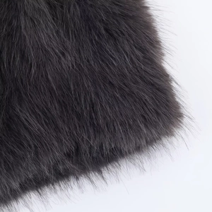 Close-up of deep gray faux fur texture showing soft high-quality long pile fabric detail