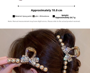 Detail view of large bow hair claw clip with rhinestones and pearls, size 10.8cm