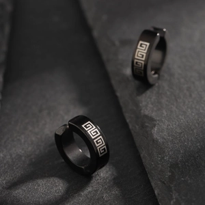 Black non-piercing titanium steel ear clips featuring classic silver meander patterns
