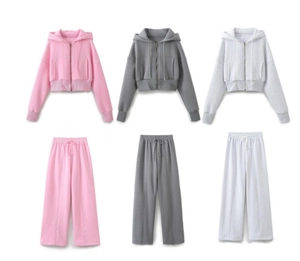 Three-color flat lay of hooded zip-up crop sweatshirts and wide-leg sweatpants set