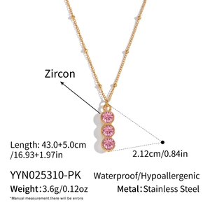 Detail showing dimensions of gold Y-necklace with three pink zircons and size specs