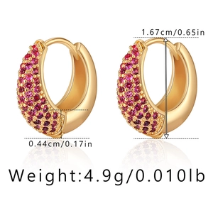 Detail view of gold C-shape earrings with red zircon inlays and precise measurements