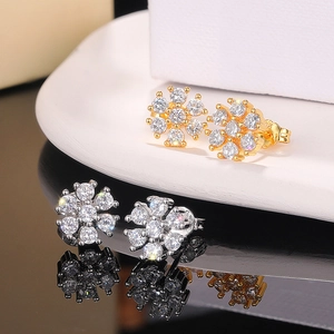 Elegant gold and silver floral stud earrings with sparkling round zircon crystals